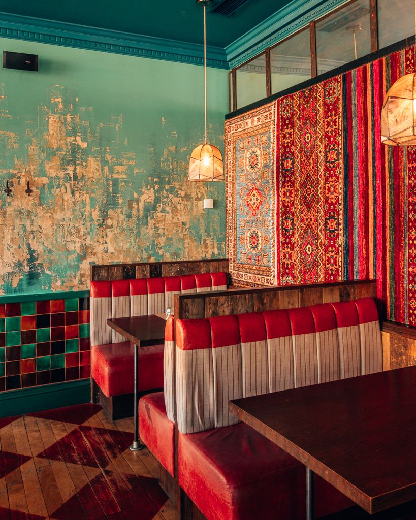 Red booth interiors at BABA