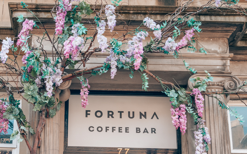 Flower covered entrance to Fortuna Coffee Shop, Edinburgh