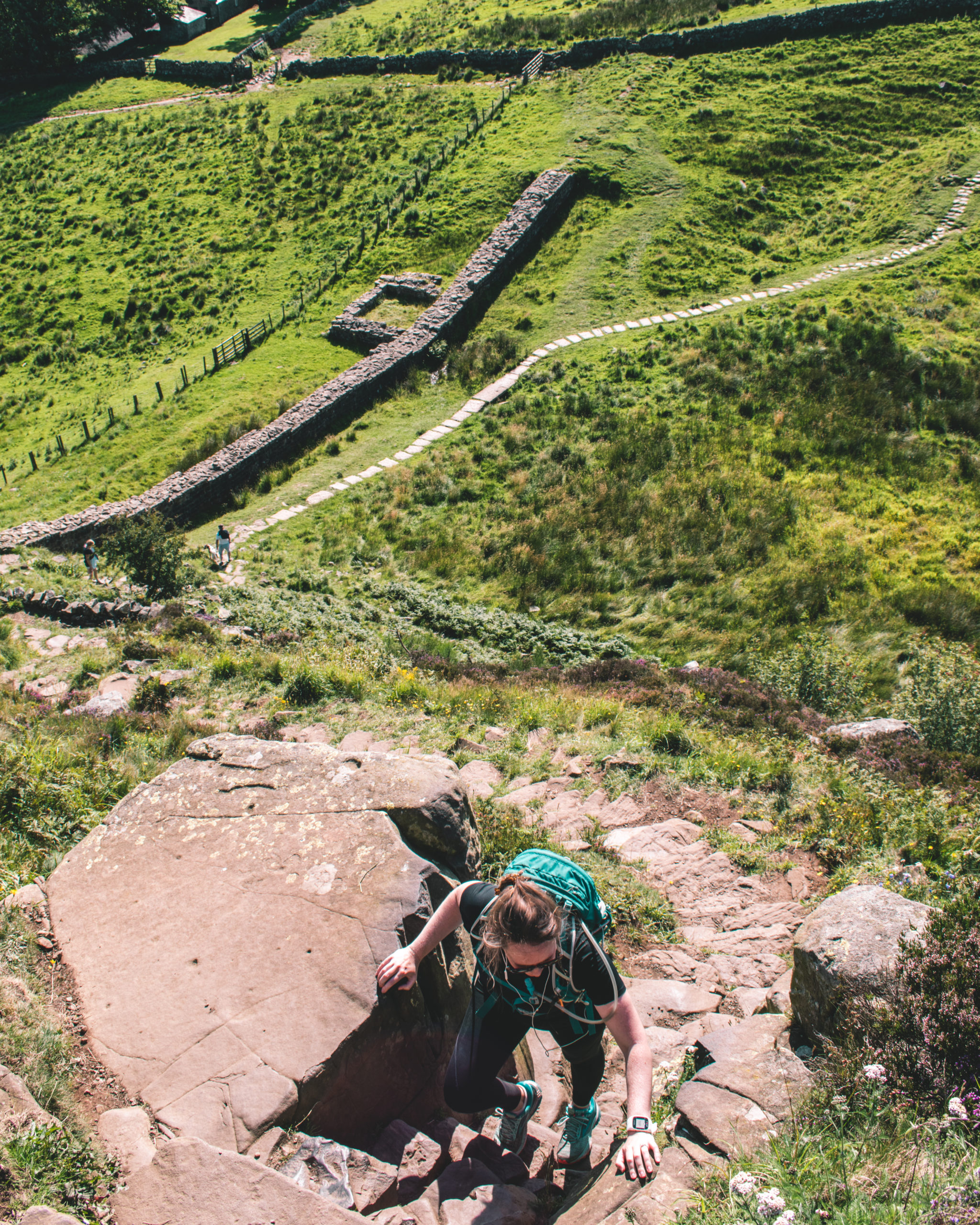 Woman hiking Hadrian's Wall path
