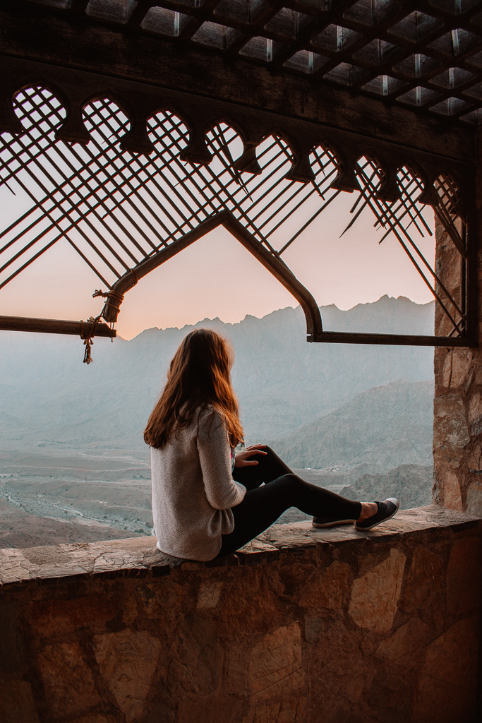Woman at Wakan viewing platform at sunrise
