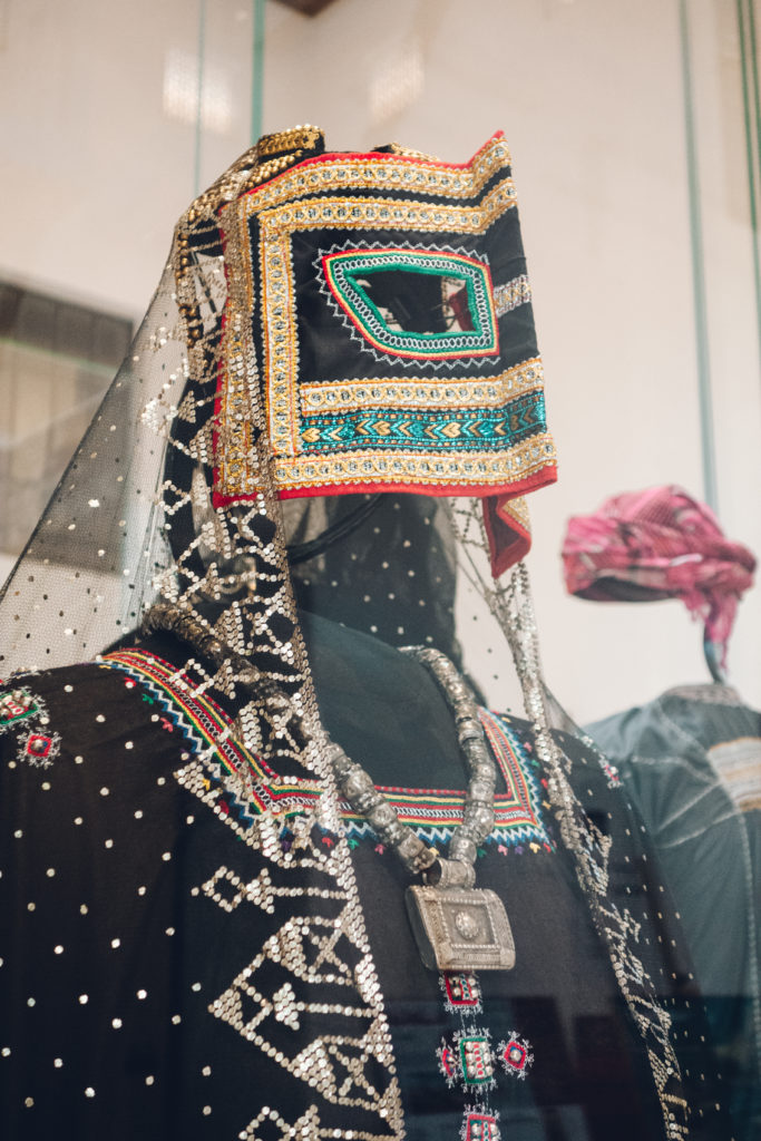 Traditional Omani women's dress and face covering on display in the National Museum