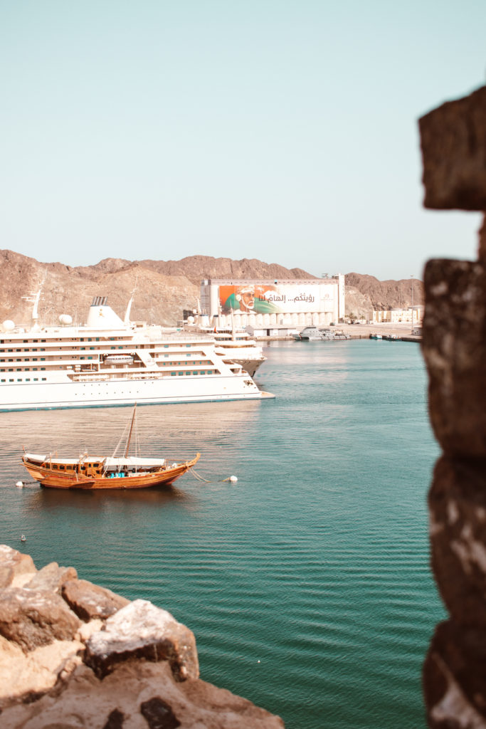 Sultan of Oman's yacht and a traditional dhow in the marina at Muttrah, Muscat