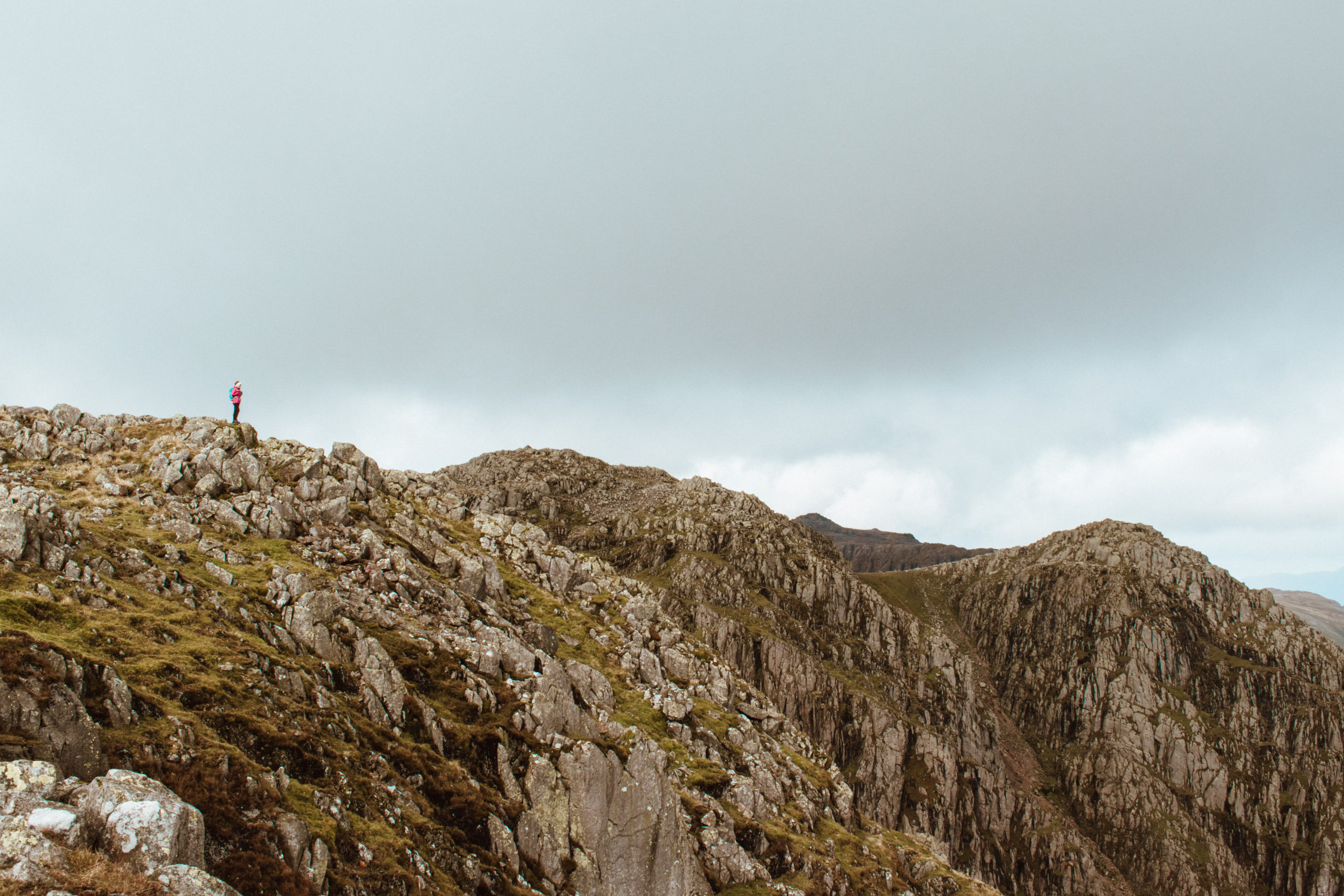 Woman hiking ridge of Crinkle Crags, Lake District