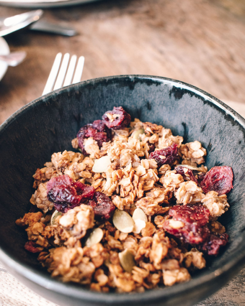 Granola with dried fruits in a breakfast bowl