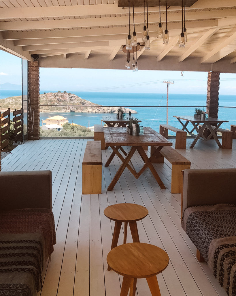 Decked terrace at Peligoni Deli overlooking the sea