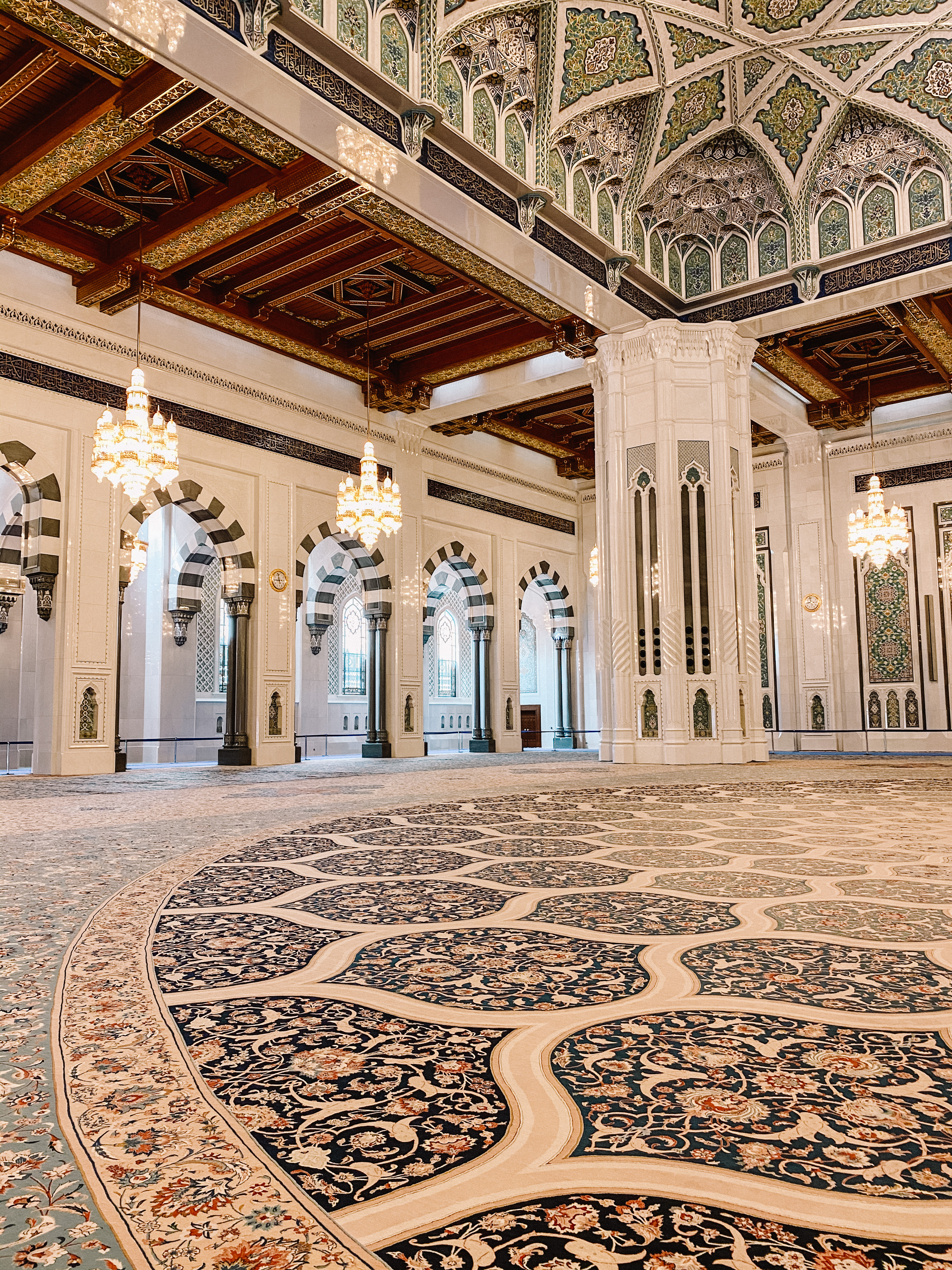 Intricately handwoven carpet in the Sultan Qaboos Mosque central prayer hall