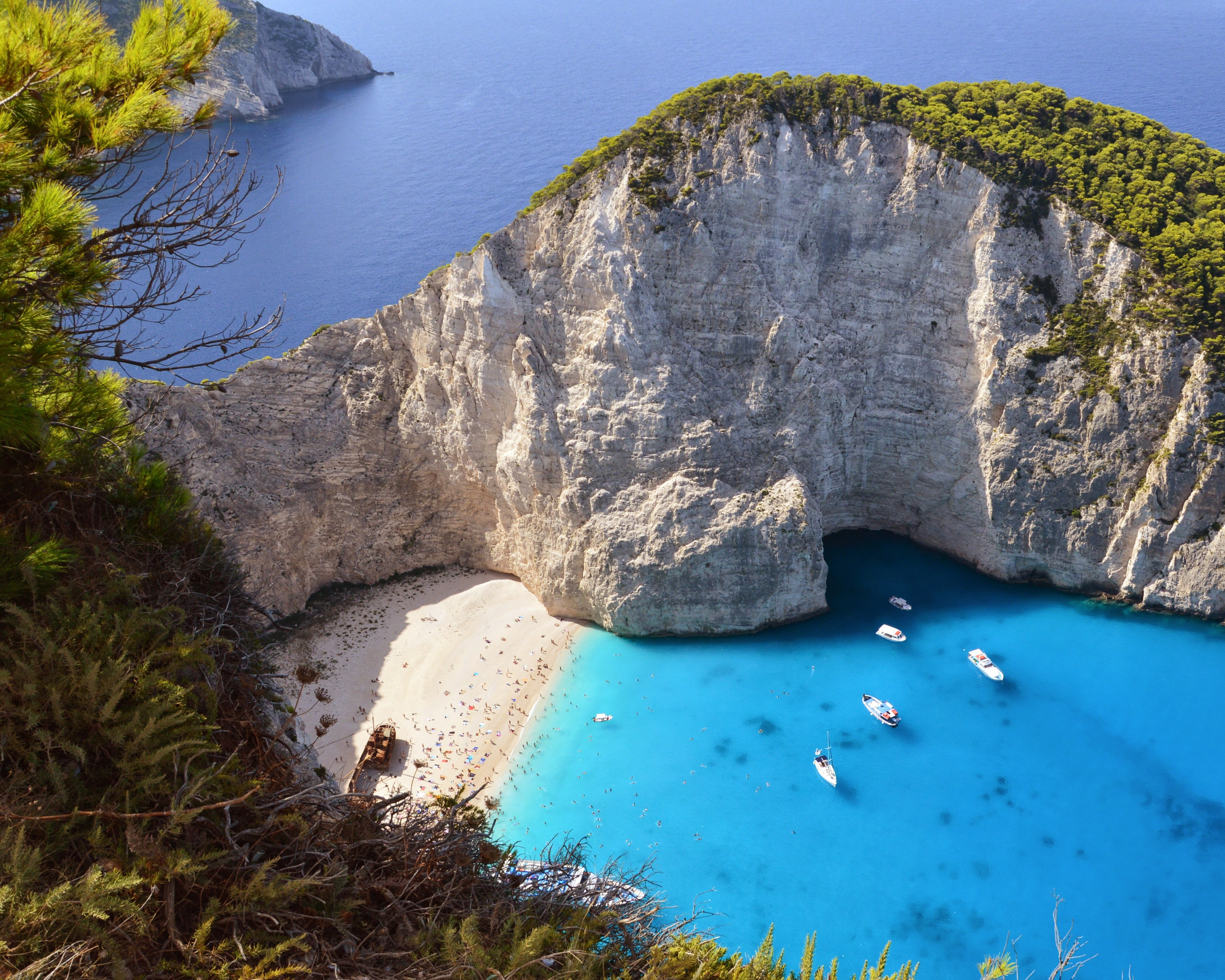 Aerial view of shipwreck on white pebble beach at Navagio