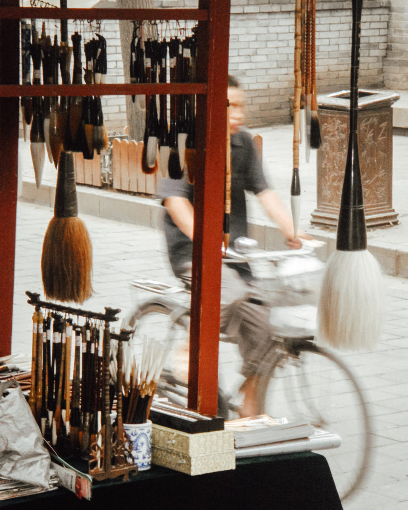 Calligraphy stall with hanging brushes, Xi'An