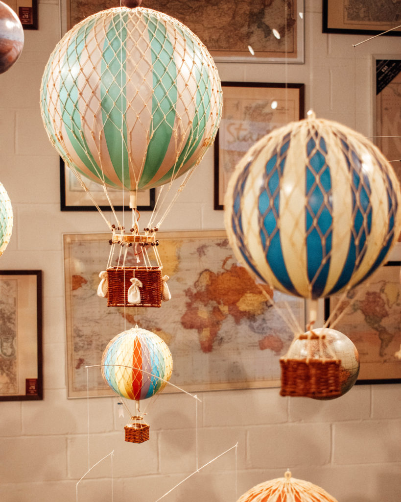 Literary London - Hanging globes and maps on the wall at Stanfords