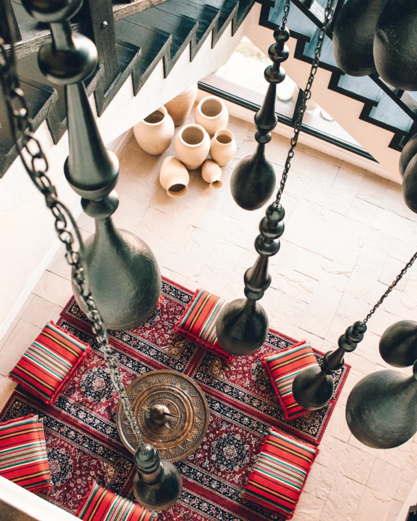 Hanging lanterns and patterned cushions