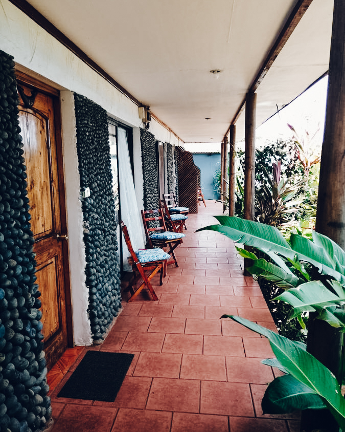 Covered terrace leading to bedrooms at Hotel Gomero, Easter Island