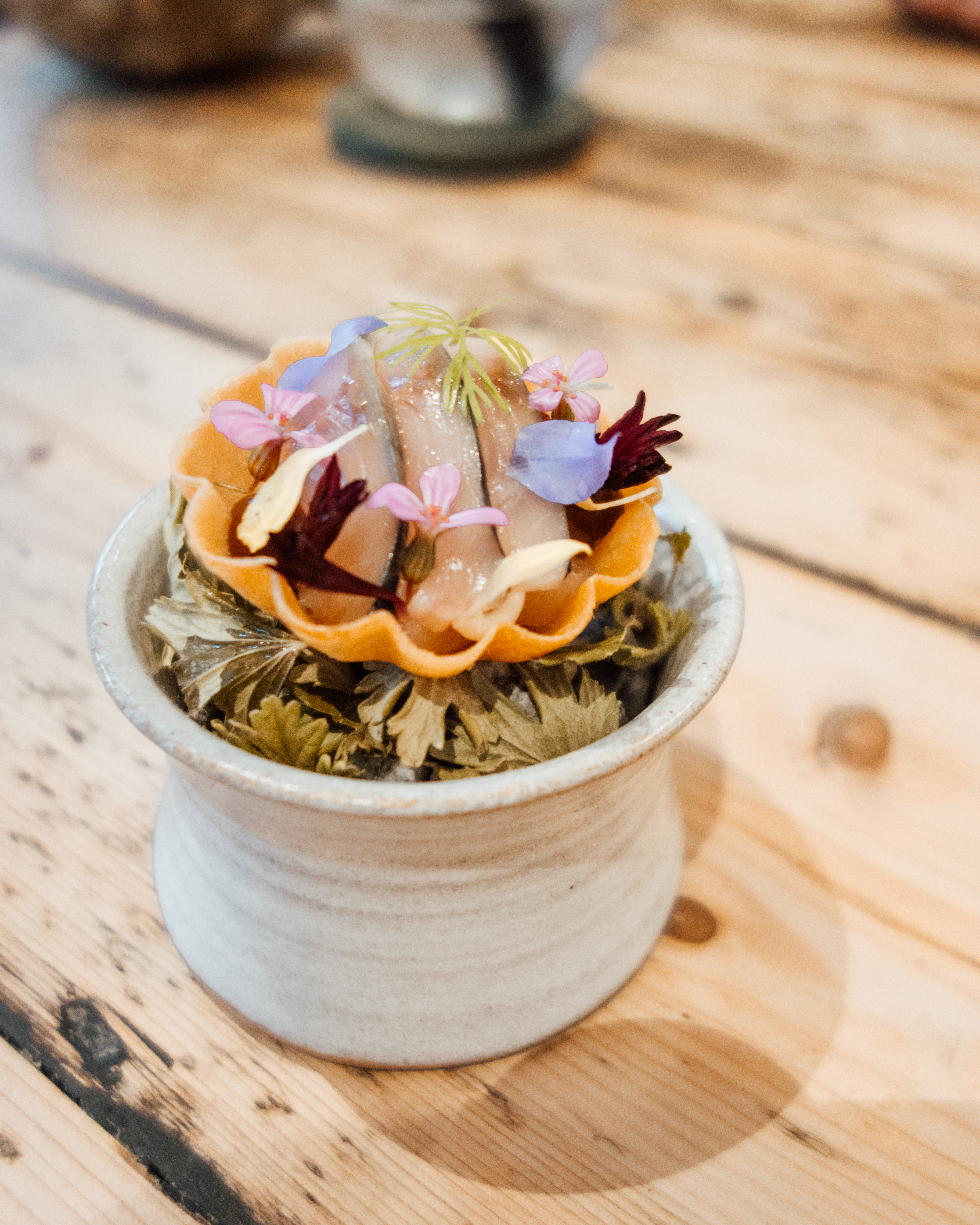 Flower strewn amuse bouche at Forest Side Hotel