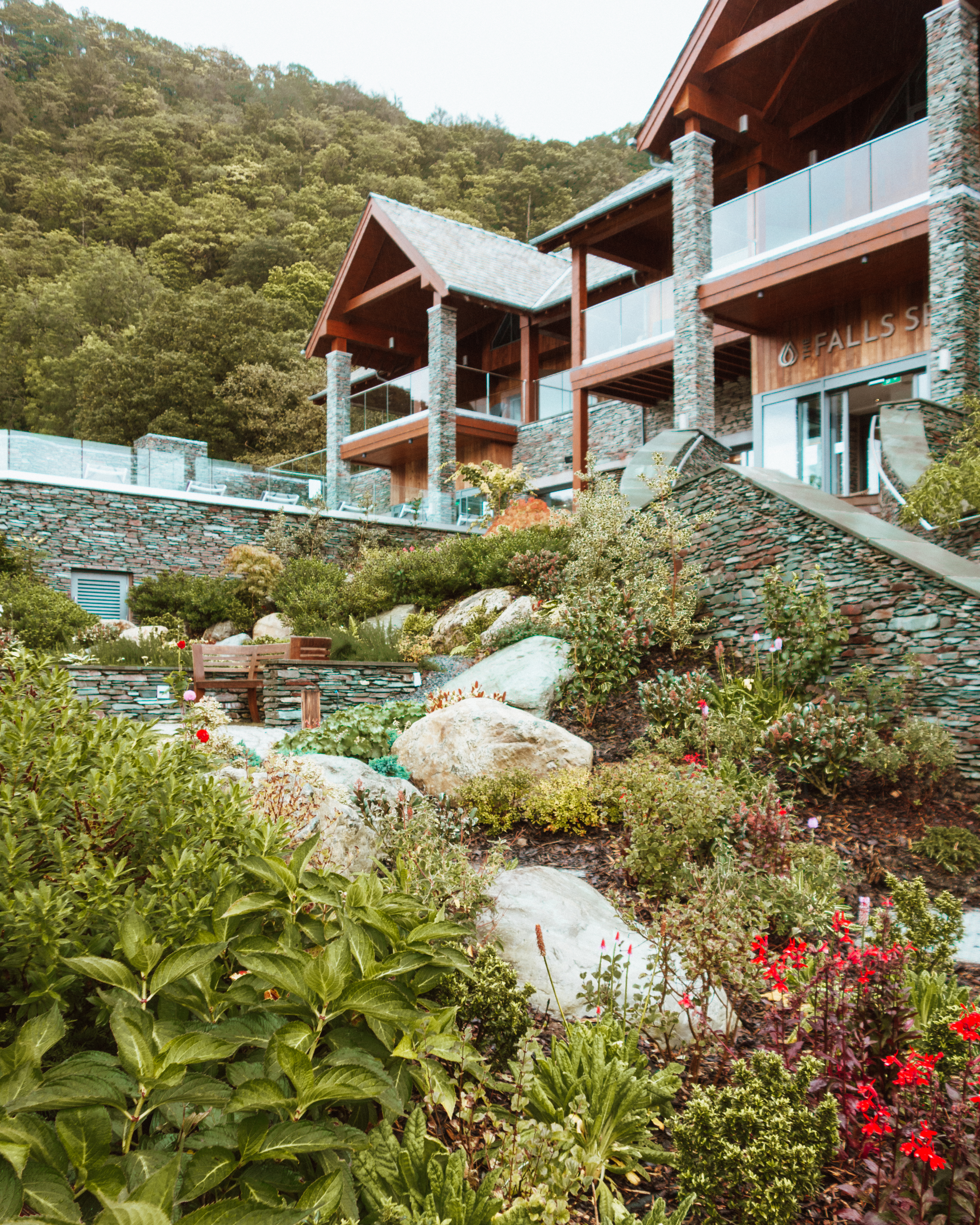 Lordore Falls Spa gardens and wooden and stone building 