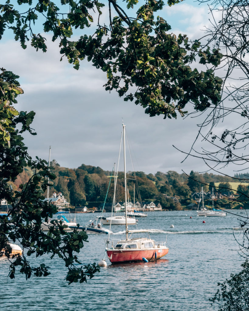 Yachts on Windermere seen through trees