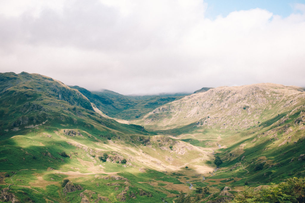 Rolling green hills on a cloudy day in the Lake District