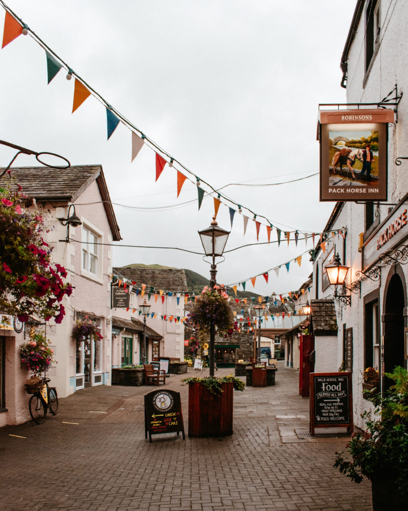 Grey rainy streets of Keswick covered in colourful bunting