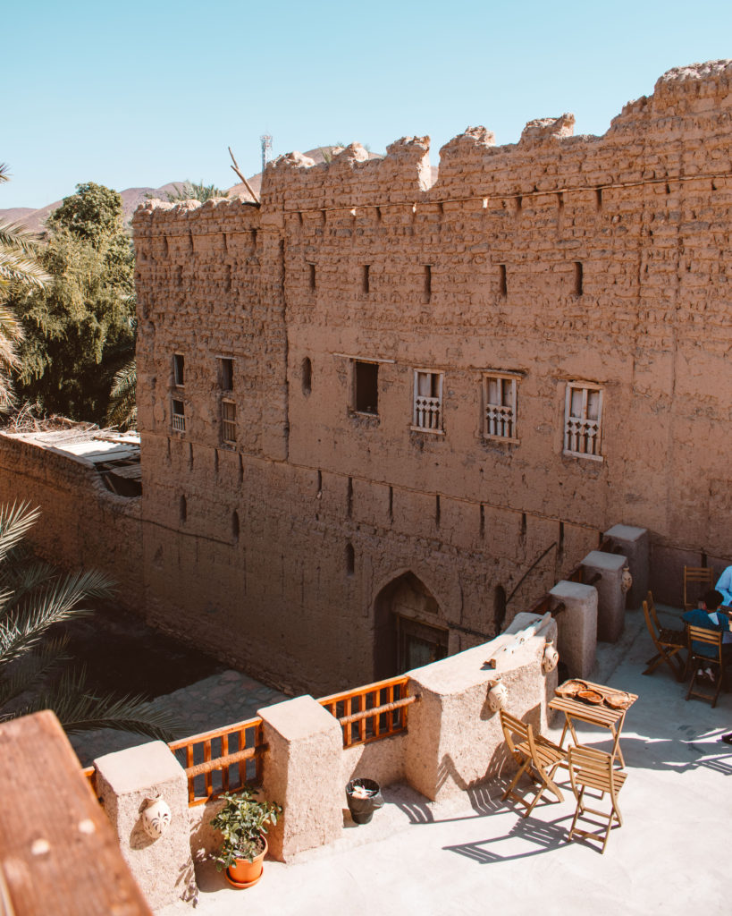 Sun drenched terrace of Bait al Sabah amongst abandoned houses in Birkat al Mouz