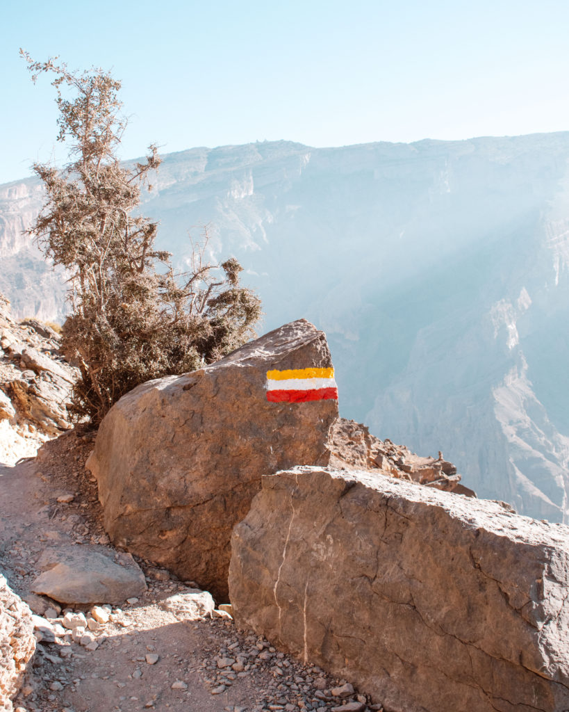 Red, yellow and white marker on the Jebel Shams Balcony Walk - these markers donate all of Oman's national trails