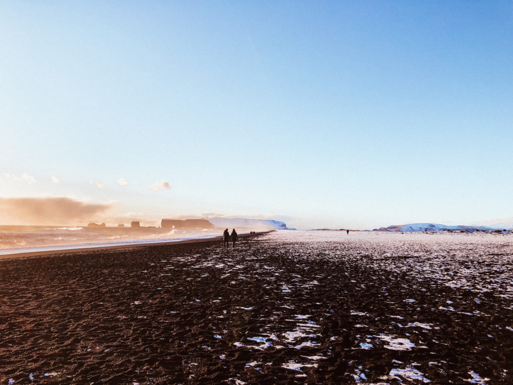 Iceland's black beach - Reynisfara at sunset in winter