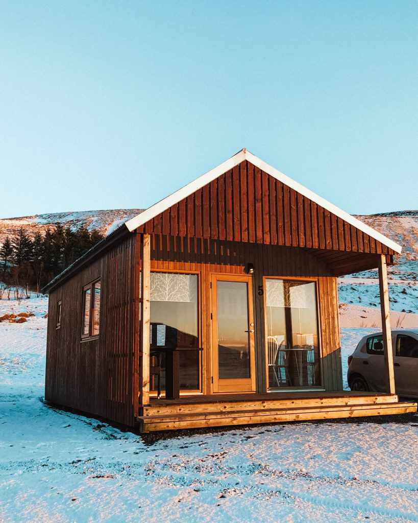 Small wooden cabin in the evening sun just outside Vik