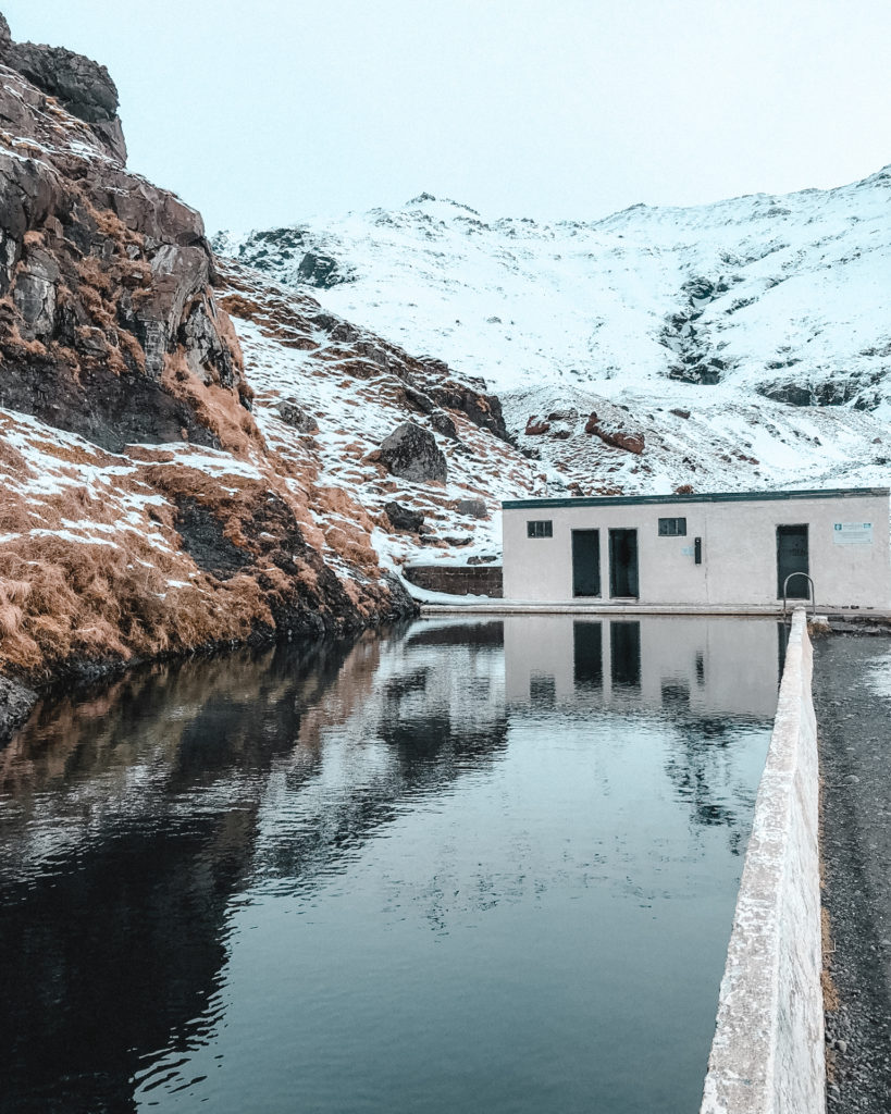 Seljavallalaug swimming pool set onto the snowy hillside