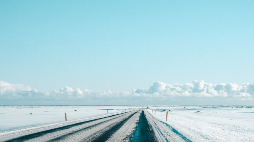 Iceland's Ring Road covered in snow under blue sunny skies
