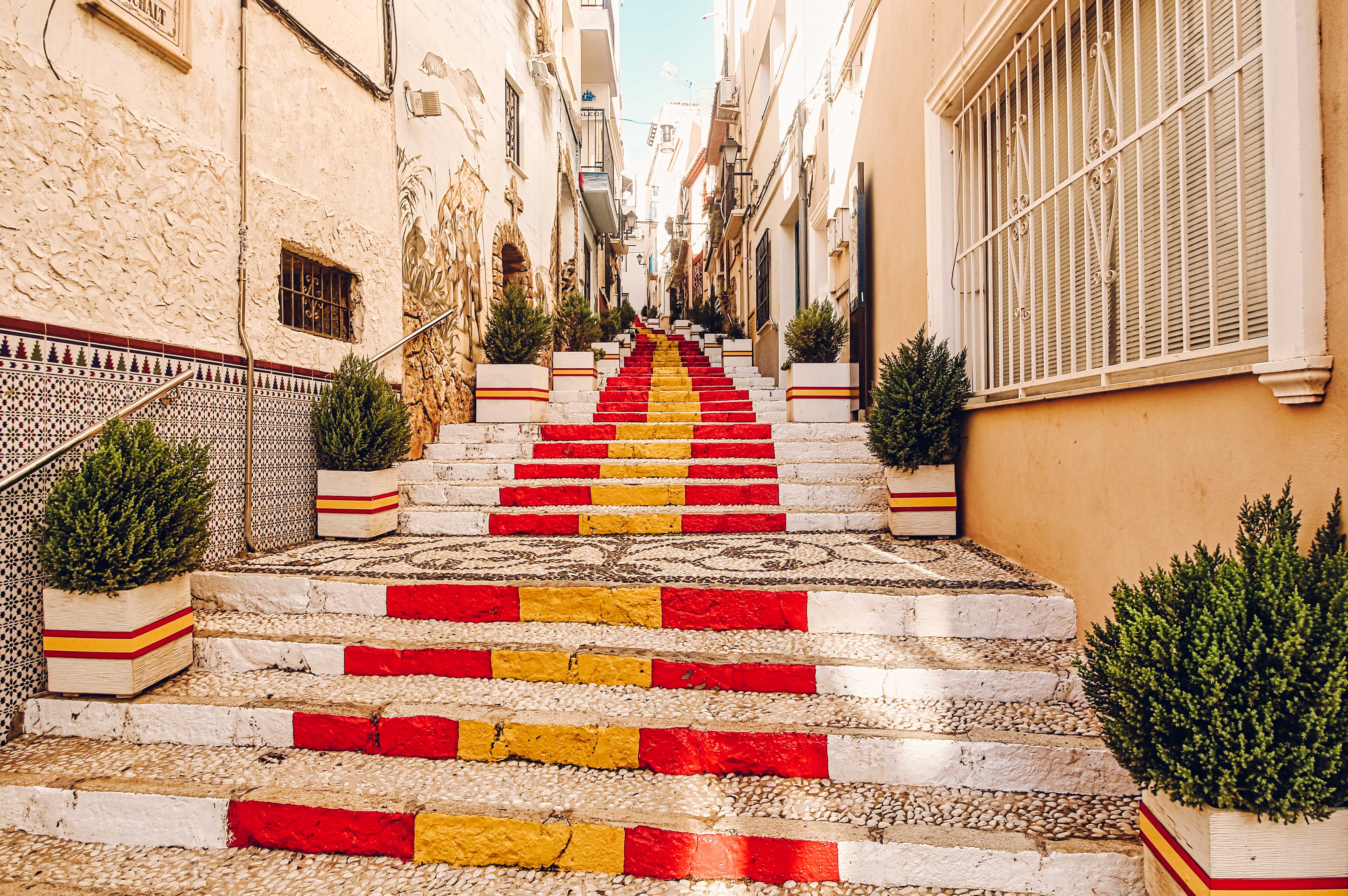 Spanish flag painted onto decorated steps in Calpe. 