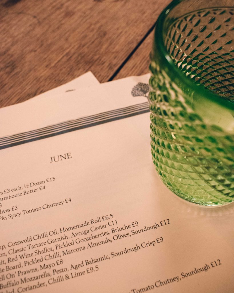 Menu and water glass at the Kingham Plough.