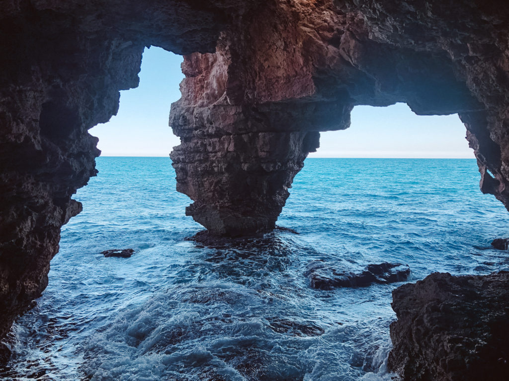 Sea swirling around the cave of Cova del Arcs on the Costa Blanca. 