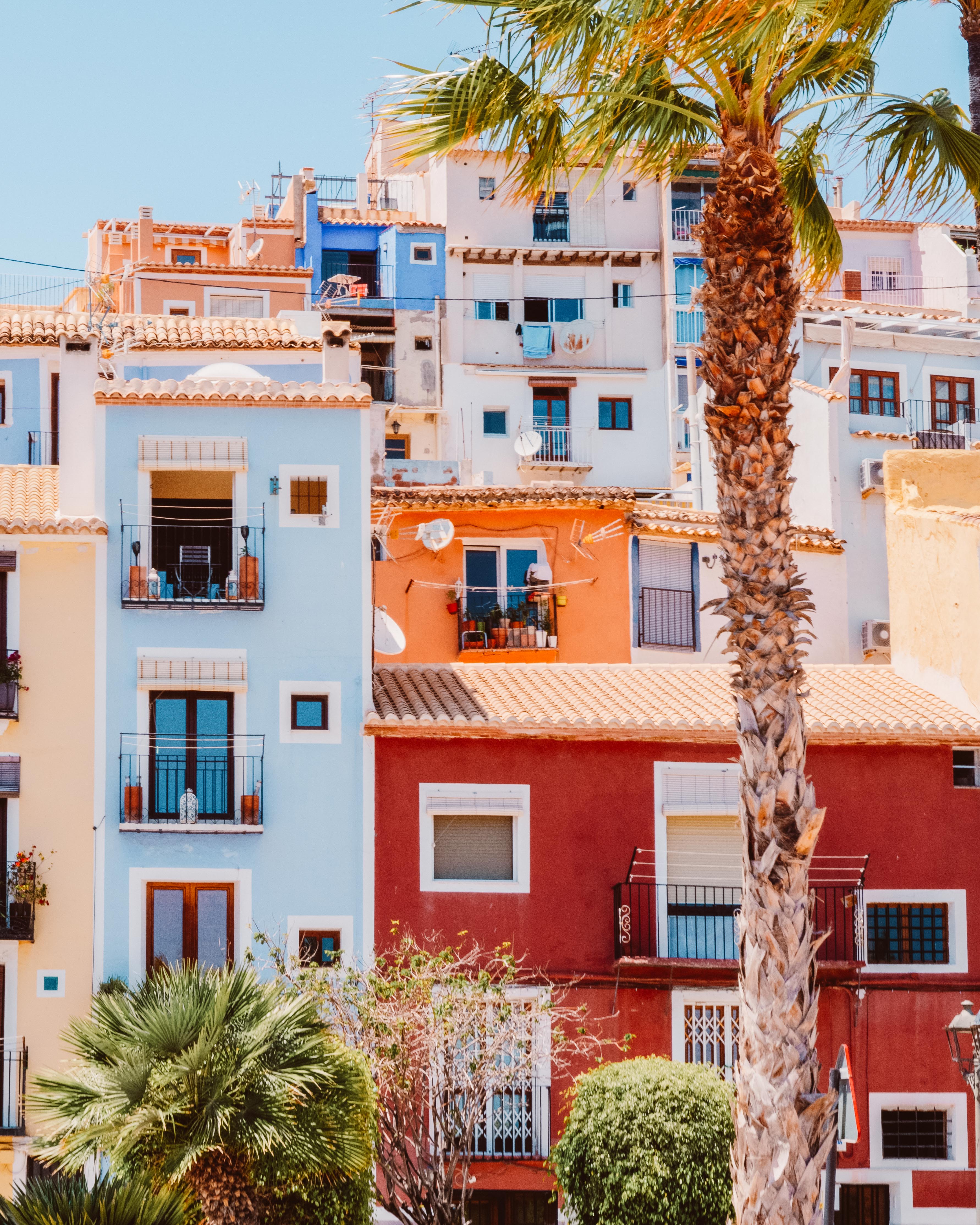 Tall red, orange and blue painted houses of Villajoyosa. 