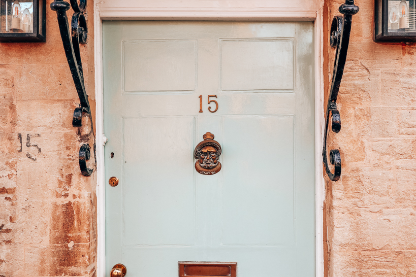 Pale blue door on stone cottage in Woodstock. 