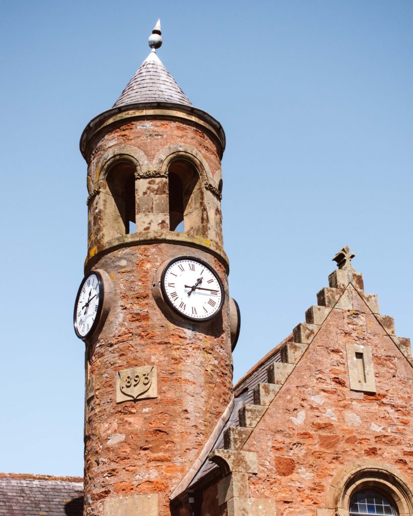 Clock tower on stone building in Gordon, The Scottish Borders