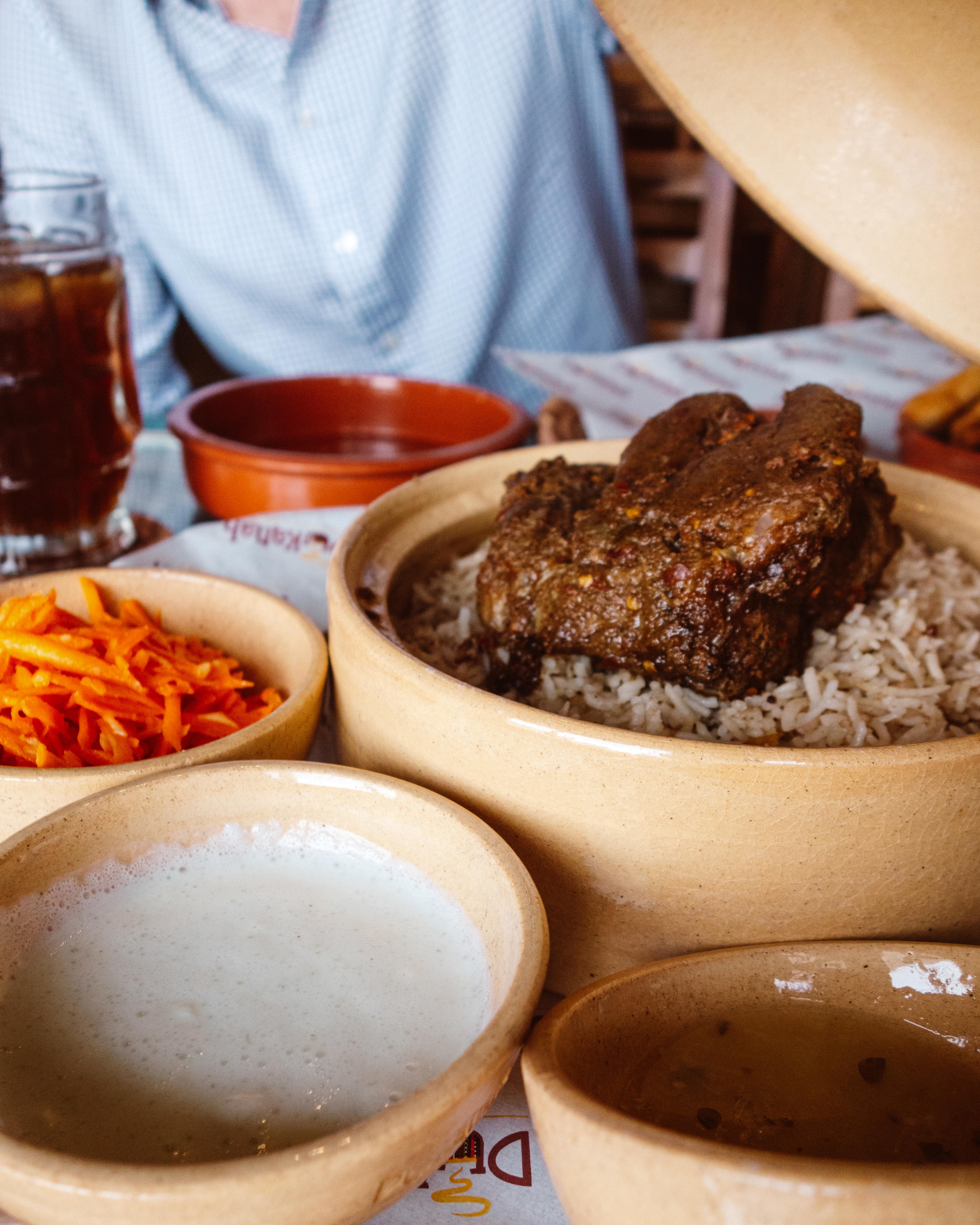Bowl of roasted lamb at Dukanah Cafe, Muscat