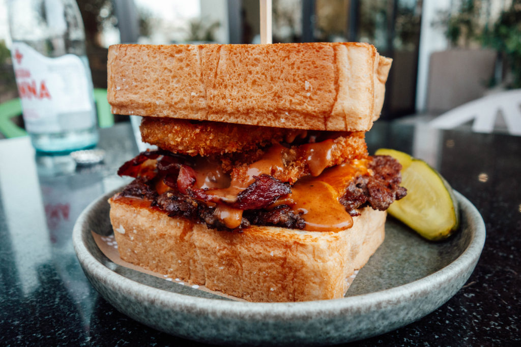 Stacked chicken and beef bacon burger at B&F Roadside Diner, Muscat
