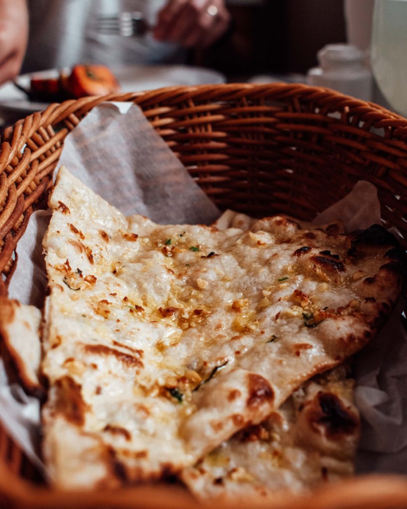 Garlic naan in a woven basket from Foodlands Oman, Muscat