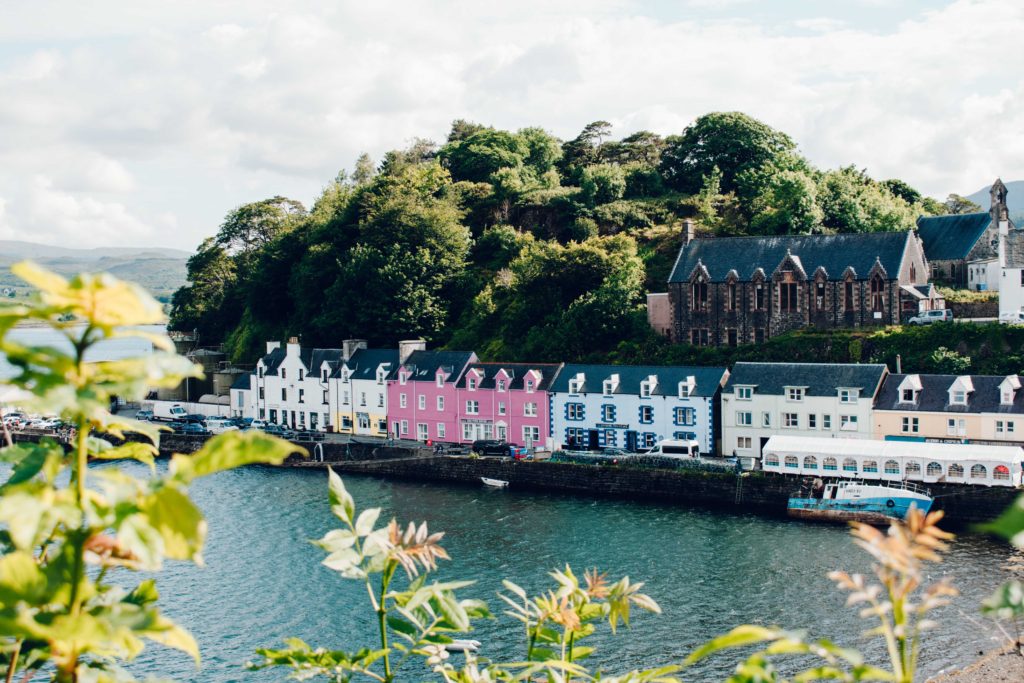 Row of pastel coloured houses in the harbour of Portree