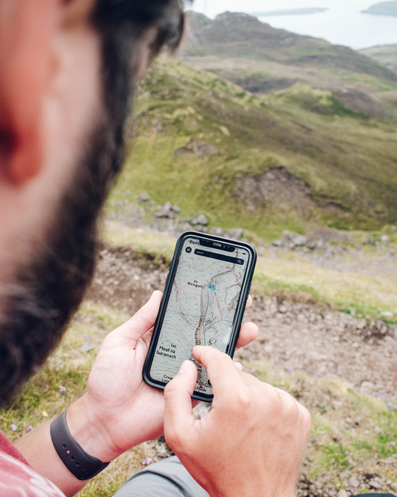 Man looking at an Ordinance Survey map on his phone