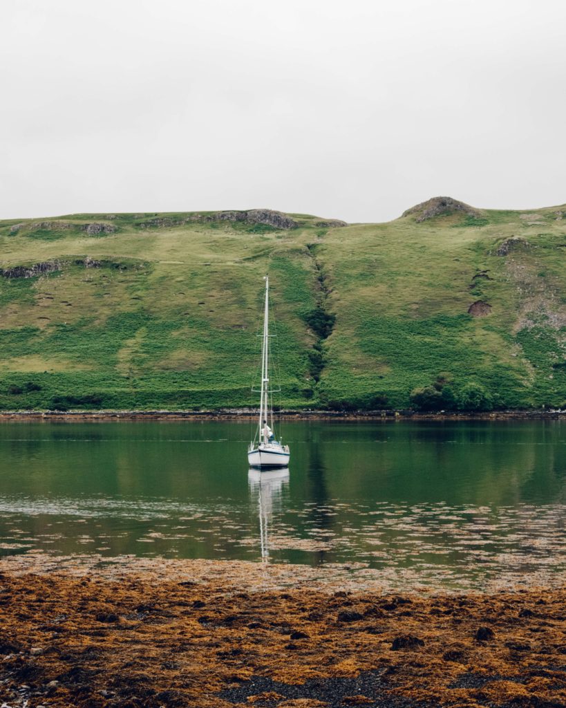 Yacht in the harbour at Carbost on a calm day