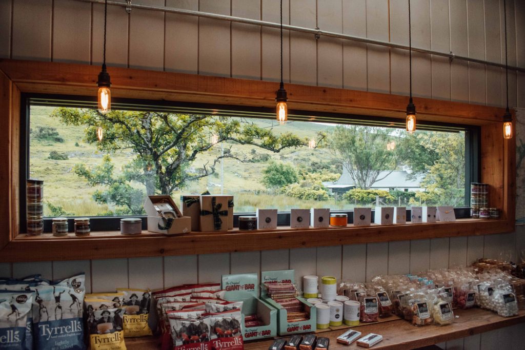 Crisps and chocolate lined up under a window at Glenbrittle Campsite Cafe