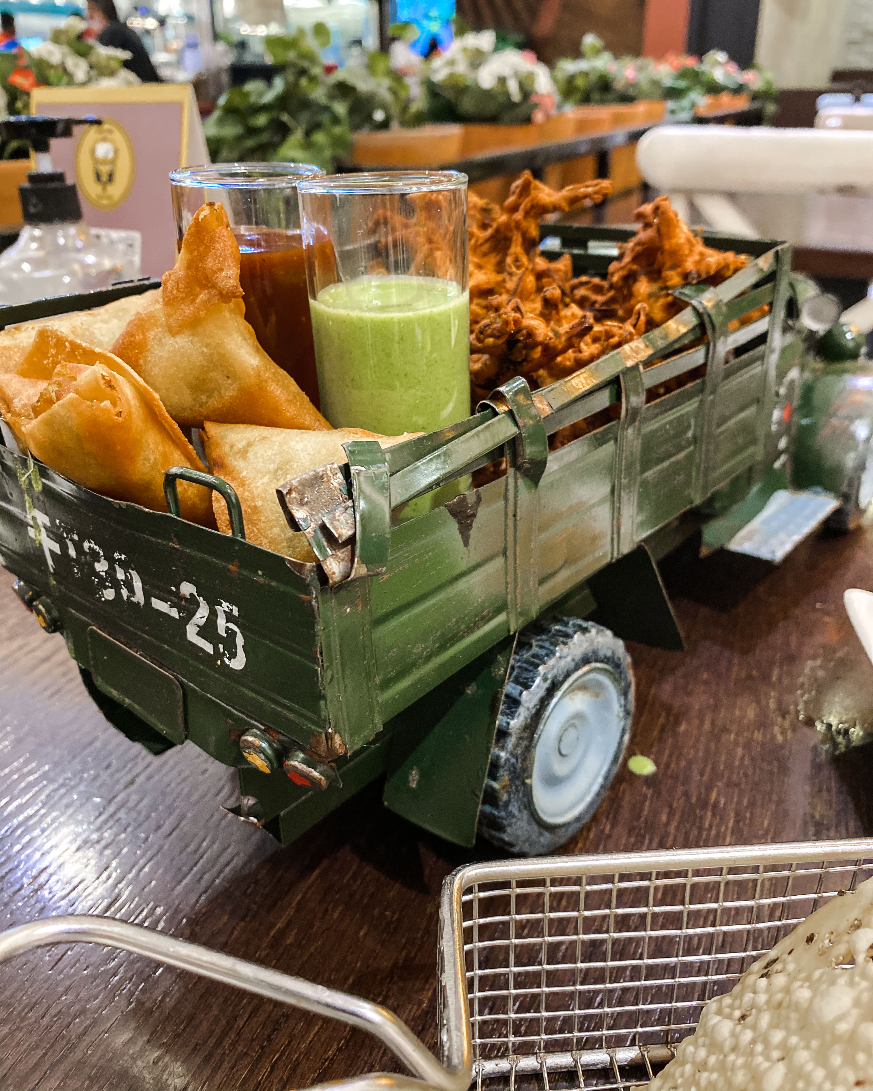 Onion bhaji and samosas in a small green truck, Tuk Tuk, Muscat