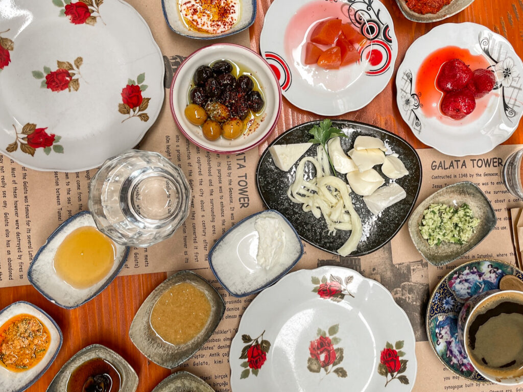 Traditional Turkish village breakfast at Cafe Privato with small plates of cheeses, jams, olives and honey