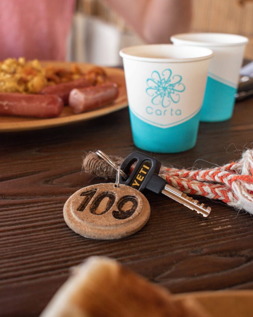 Room key with number 109 in front of plate of breakfast food at Nizwa Antique Inn