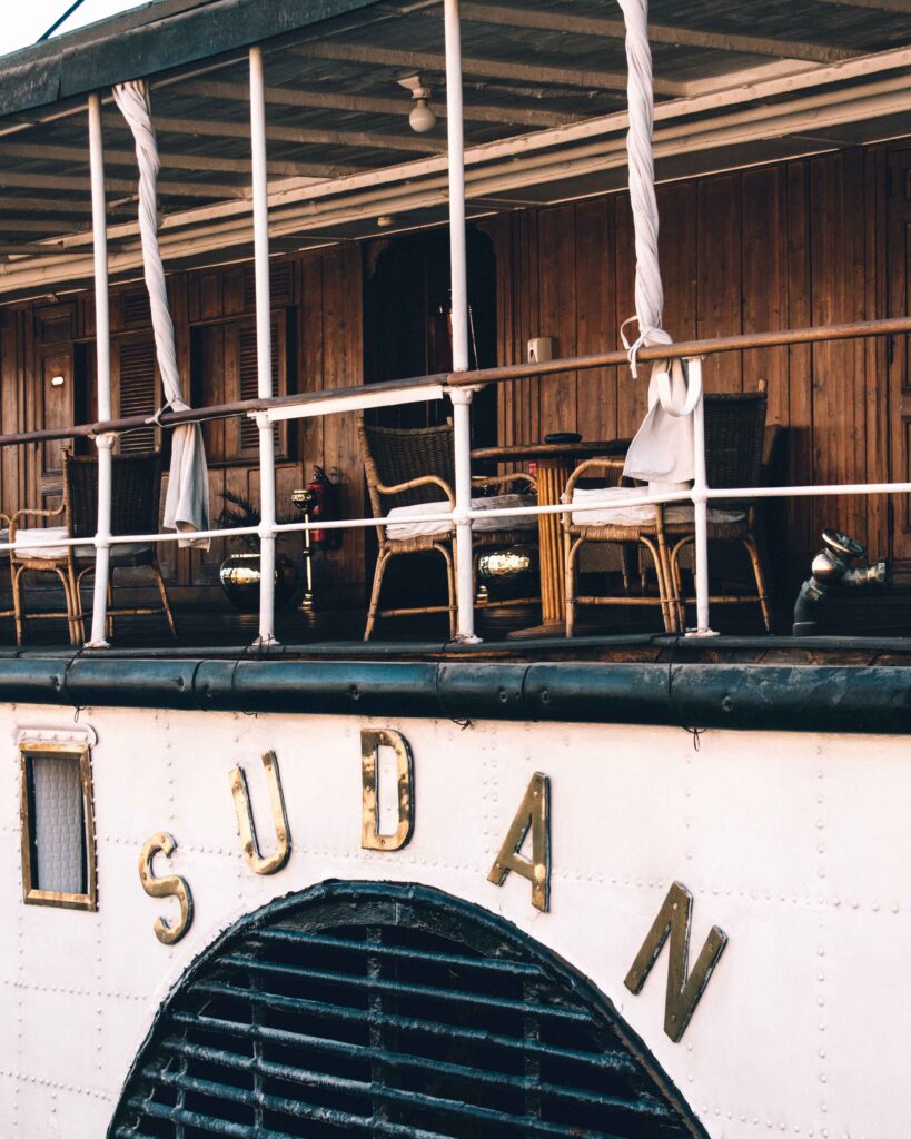 Gold lettered name plate on the side of the Steam Ship Sudan