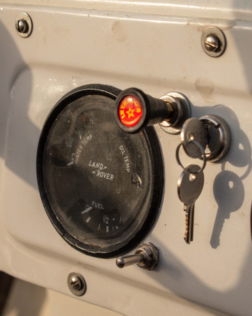 Close up of Land Rover petrol gauge and key