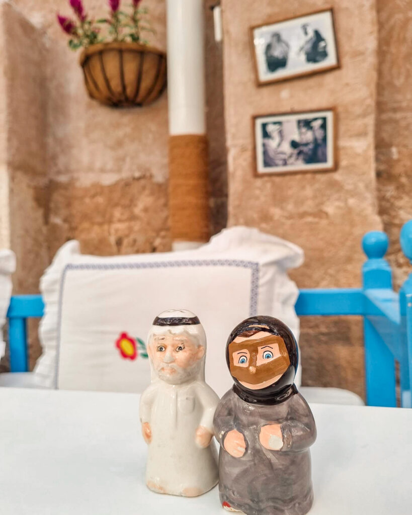 Salt and peper shakers at Arabian Tea House, Dubai, shaped to look like an Emirati man and woman in traditional dress