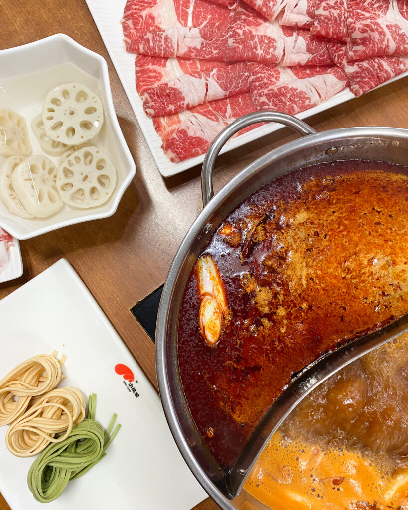 Hotpot with two soups, sliced meat and noddles at Little Lamb Hotpot, Dubai