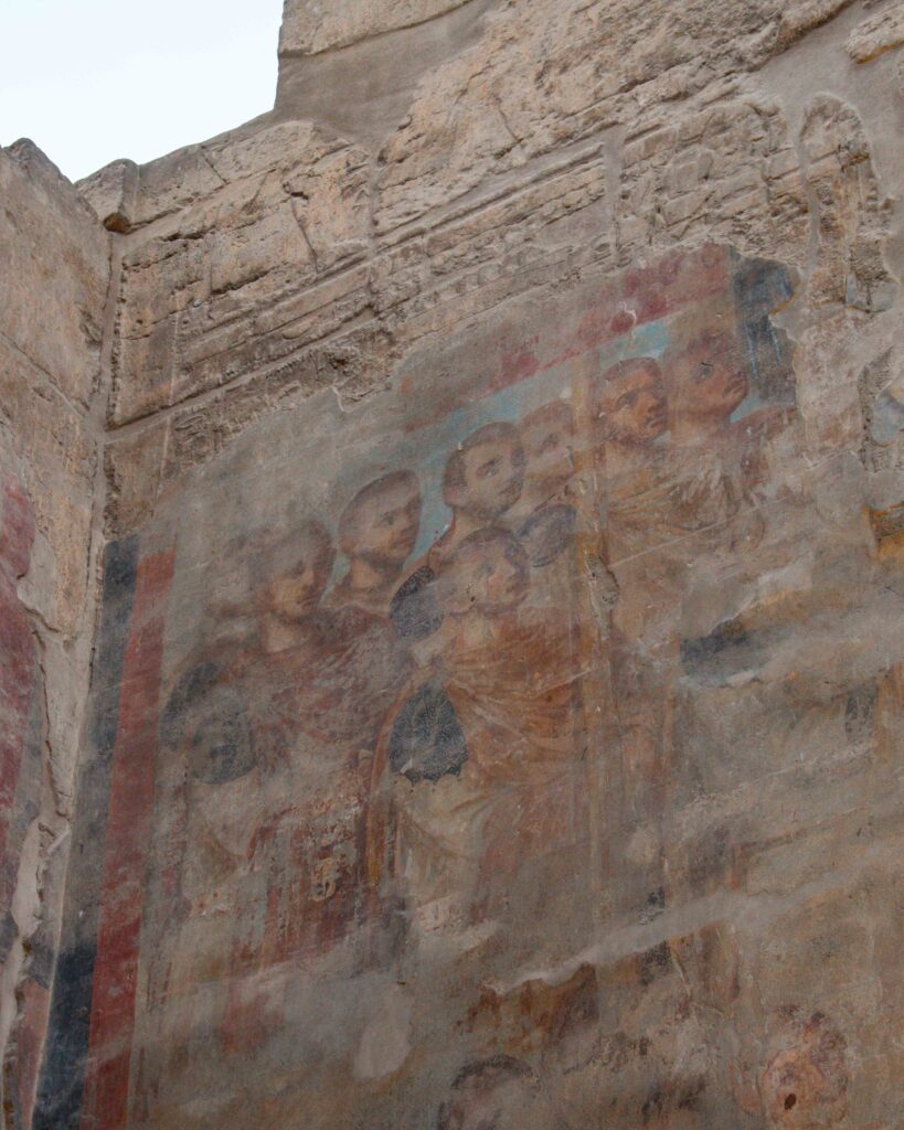 Coloured Coptic christian painted images on the walls of Luxor Temple