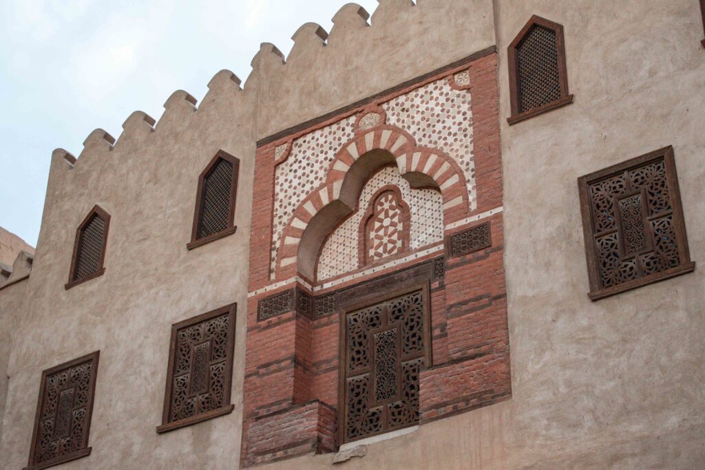 Tiled mosque entrance door half way up a wall at Luxor Temple