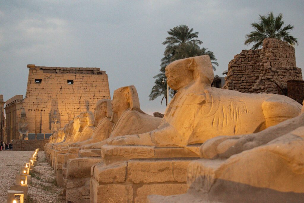 Avenue of the Sphinx lit up at dusk