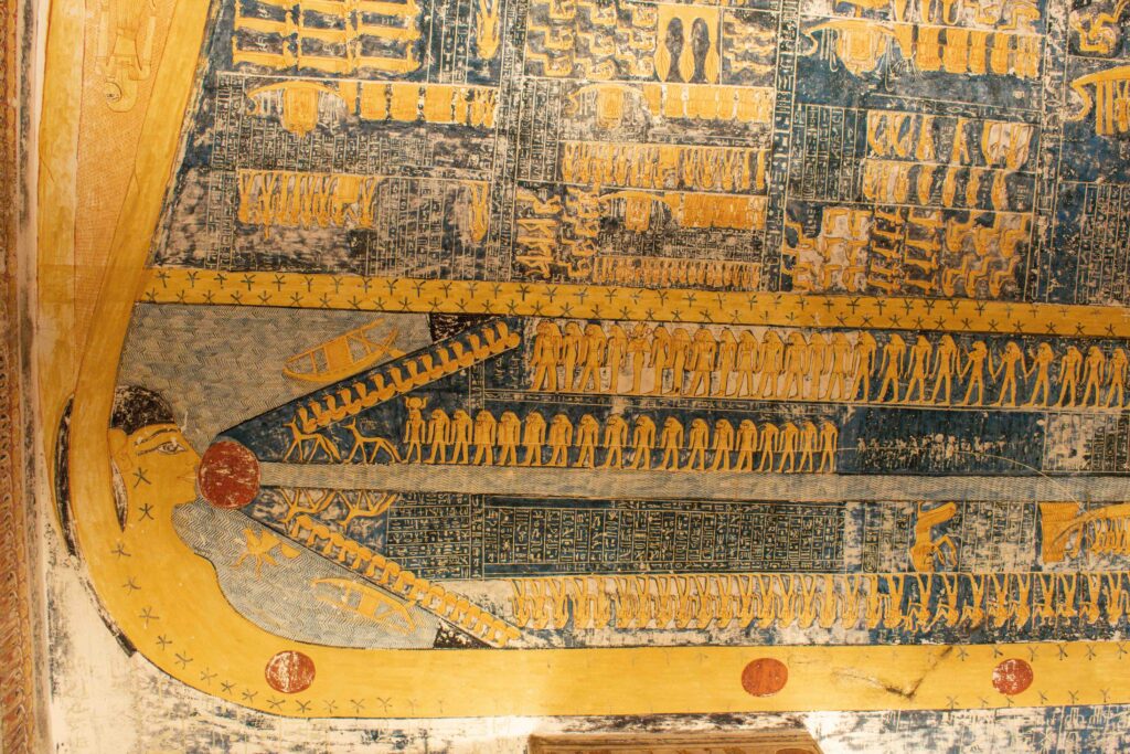 Intricately painted blue and yellow funerary text in tomb at Valley of the Kings 